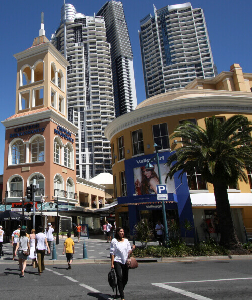 Shoppers on Cavill Avenue Surfers Paradise with high-rise towers